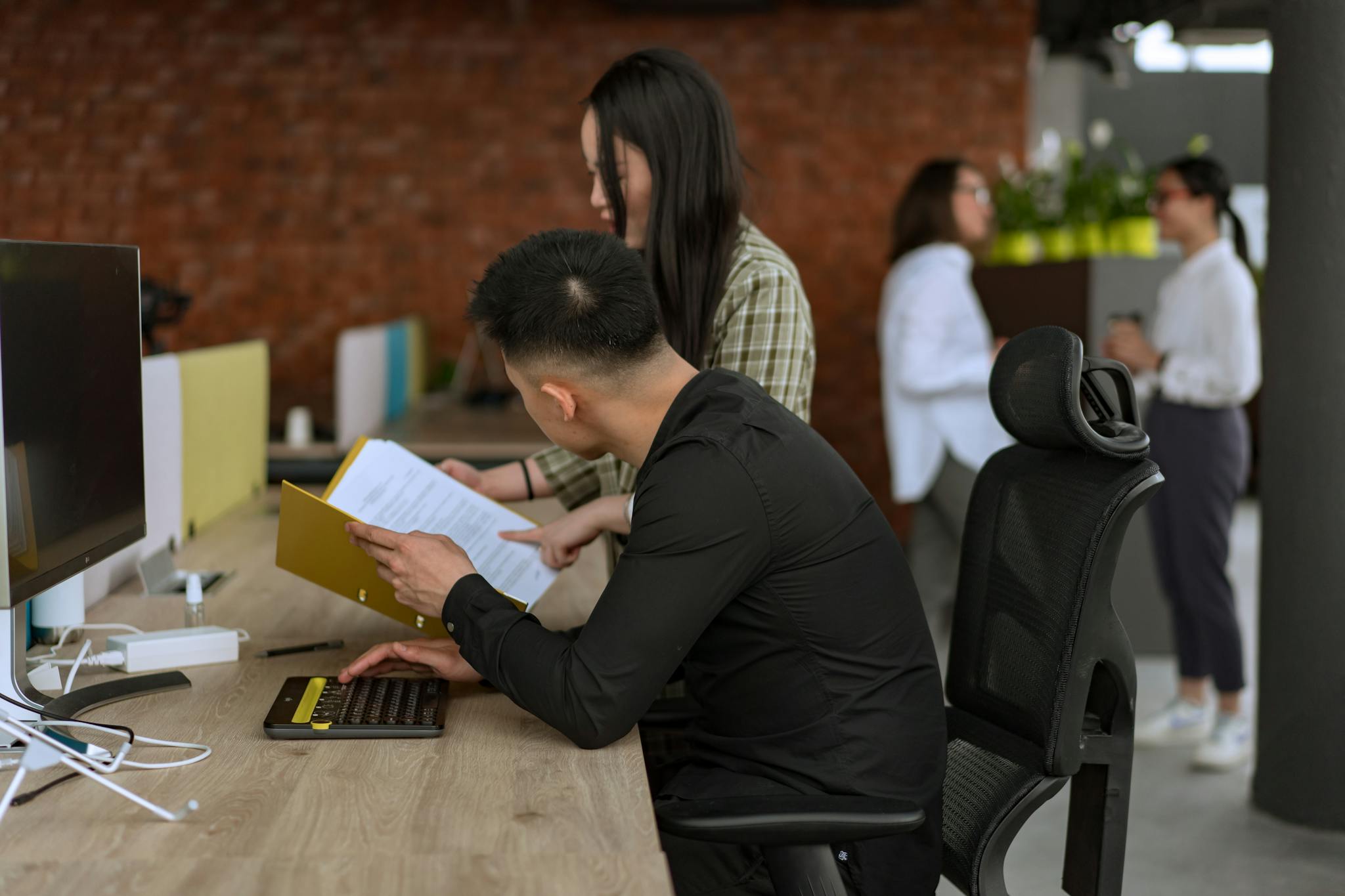 Diverse team collaborating in a modern office setting, enhancing productivity.